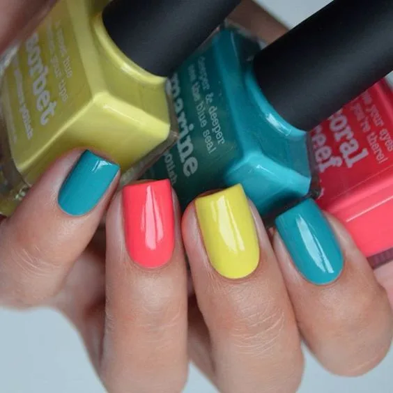 Neon multi-colour nails with teal coral and yellow tones
