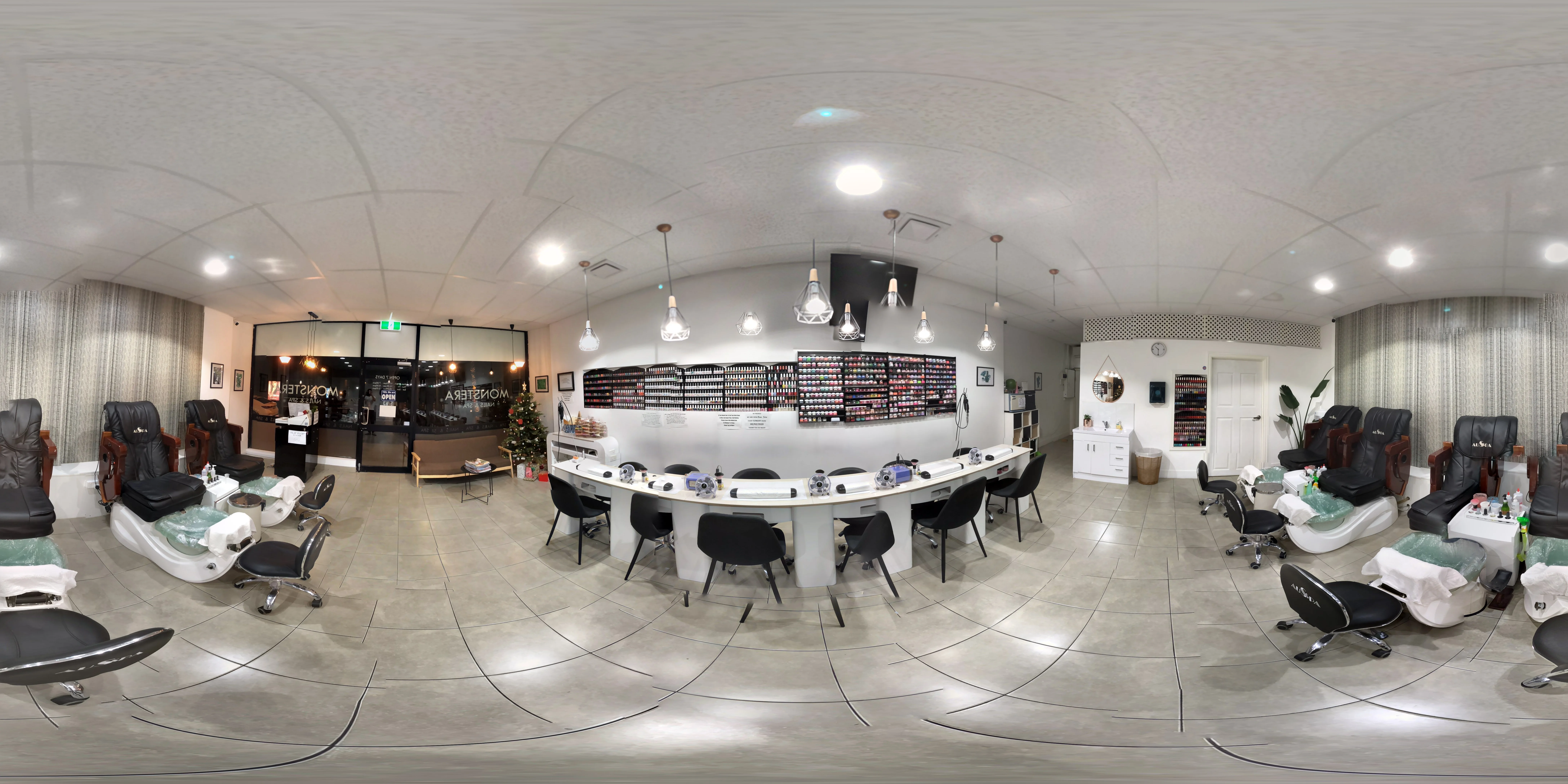 MONSTERA Nails & Spa — 360 degree panorama of the pedicure room, white manicure island, and salon signage